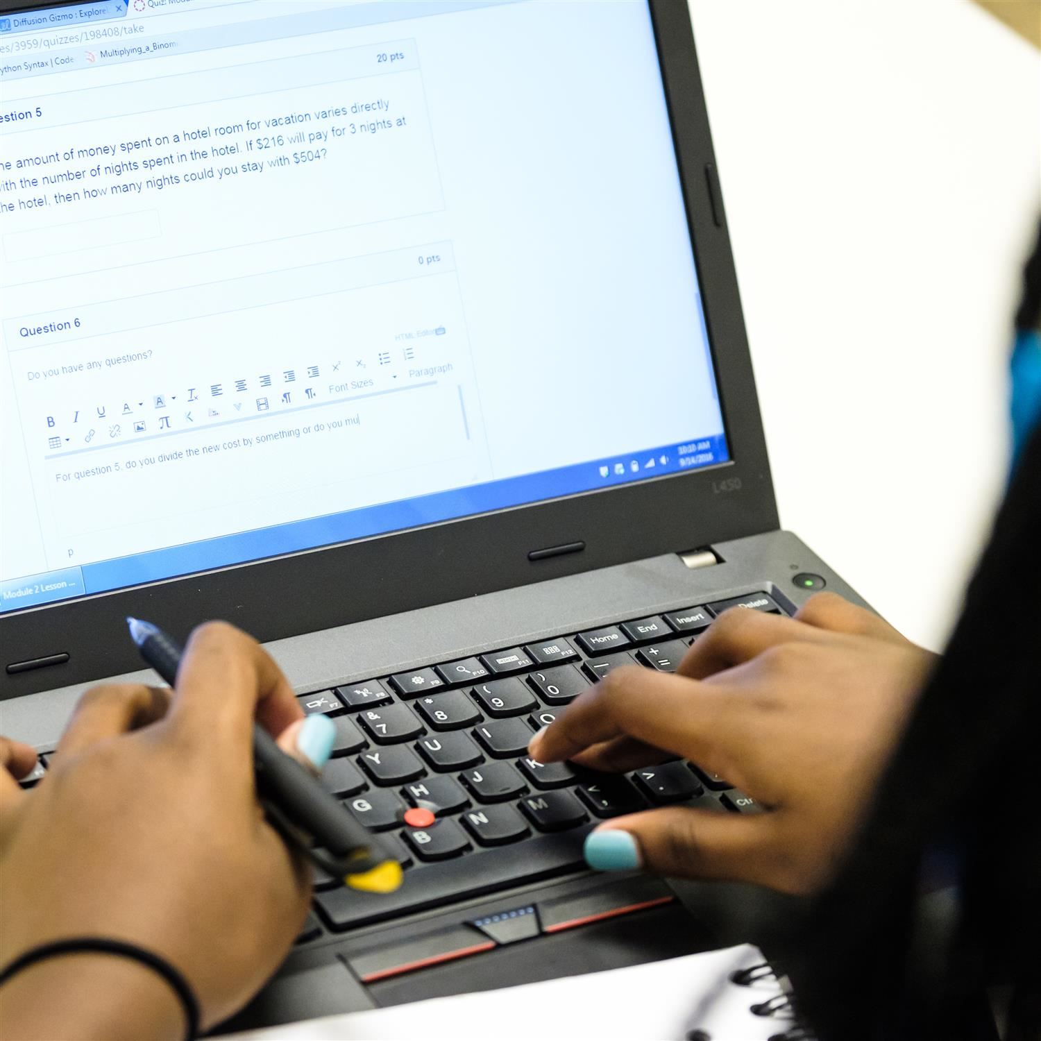  hands working on a computer